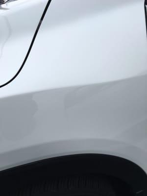 2016 Honda HRV front fender with door ding damage after fixing by Dent Doctor.