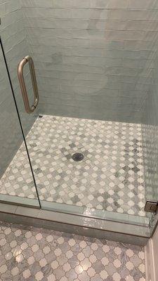 Updated shower remodel with mosaic tile.