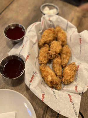 Golden Original Wings with secret sauce and hot spicy sauce on the side