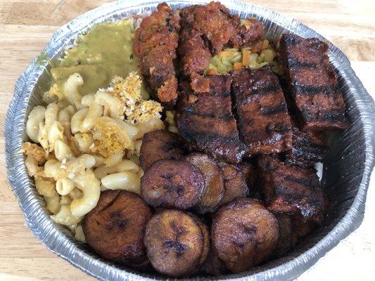 Jerk tofu, curry tofu, fried mushroom, Mac and Cheese, Cabbage, fried plantains