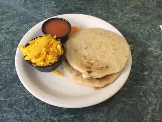 Pupusas de queso y loroco and mixta  Stuff tortilla with loroco and cheese and mix ground pork/cheese