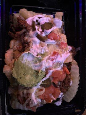 Carne Asada Fries - queso, sour cream, guacamole, jalapeños, shredded cheese, and pico de gallo on a bed of crinkle cut fries.