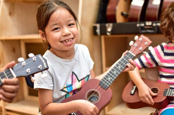 Group Ukulele and Guitar classes are a great introduction to studying music at BMS