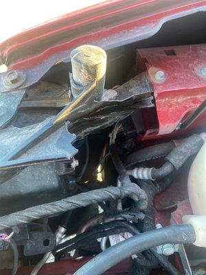 Broken radiator support from previous accident.