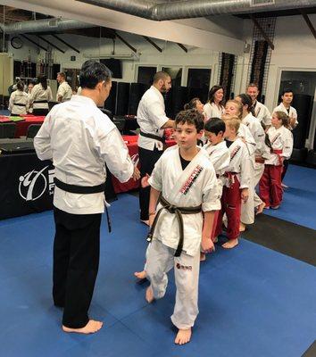 Congratulating the students who passed their belt exam