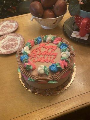 A Chocolate cake, raspberry filling covered in a chocolate buttercream.