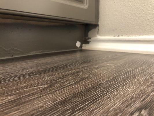 More poorly done baseboards and cabinets that they said they would fix it but didn't after two years