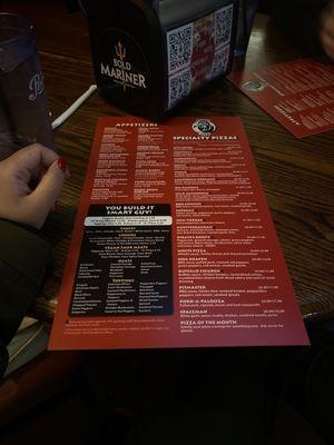 Front page of the menu, and the qr code on the napkins dispenser for the beer list!