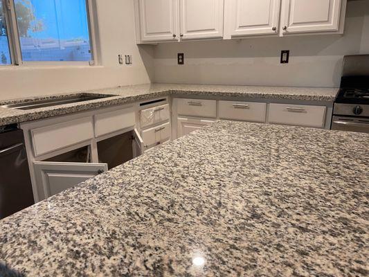 Kitchen countertops and island. Under mounted sink.