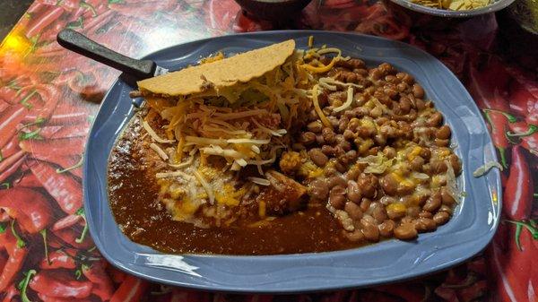 Cheese Enchilada, taco, rice and beans.