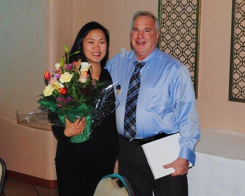 Lee appreciating his Transaction Coordinator and his right hand Liz Gozun.  She makes all of the awards possible.