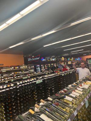 Wine selection! I just noticed the guy giving the peace  on the side! Cheers to him!