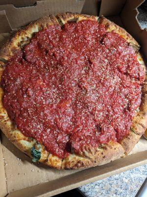 Italiano deep dish with caramelized onions, meatballs, and spinach