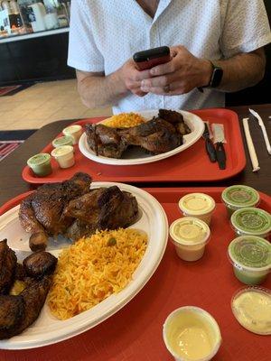 Half chicken plate with yellow rice and Fried Plantains.  Extra sauce of course!