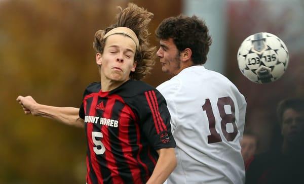 Jeremy Gundlach heads the ball during a WIAA regional soccer final.