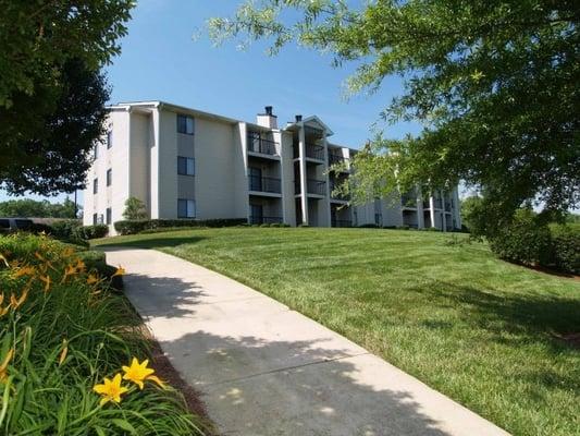 Gorgeous green landscaping awaits at Trinity Park Apartments