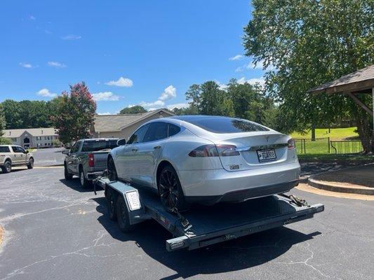 Tesla with a bad tire and no spare - needed to be towed.