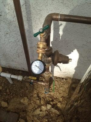 Water pressure test at the main supply to the house.Pressure not to exceed 80 PSI