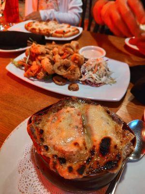 Three onion soup, fried calamari, and flat bread margarita