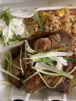 Grilled pork chops, shrimp fried rice, salad and some secrecy grilled veggies under the chops. The chops were seasoned really good!