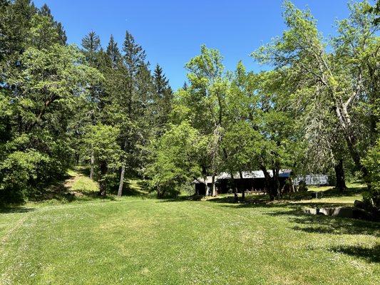 The Creekside Campground with stables in the background