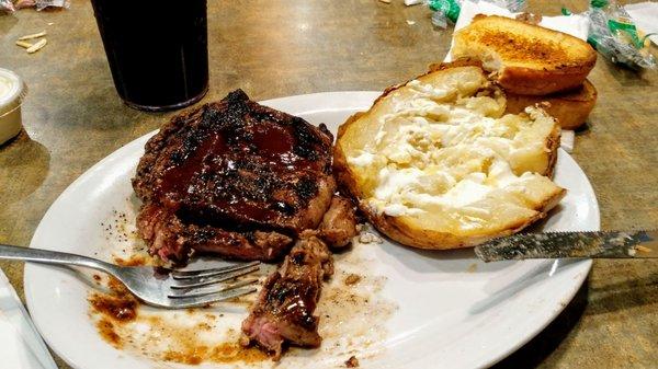 ribeye; Med. seasoning salt and A1 baked potato little butter sour cream garlic toast and diet Pepsi