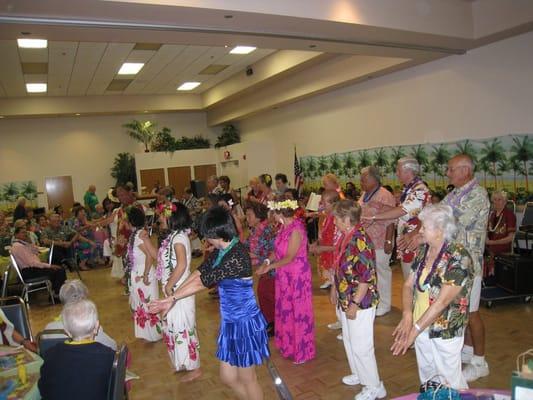 Learning to Hula at the Annual Luau