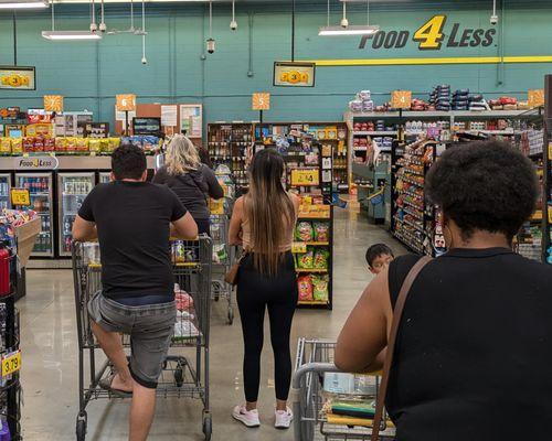 Waiting in line, around 10 AM on a Saturday morning. Only two checkout aisles were open.