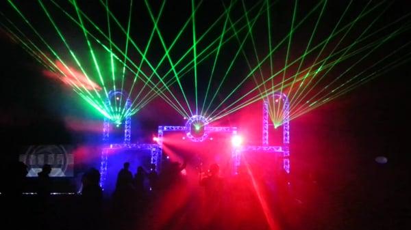 Large outdoor festival stage. We provided staging, truss, lighting, lasers and sound for this massive EDM event.