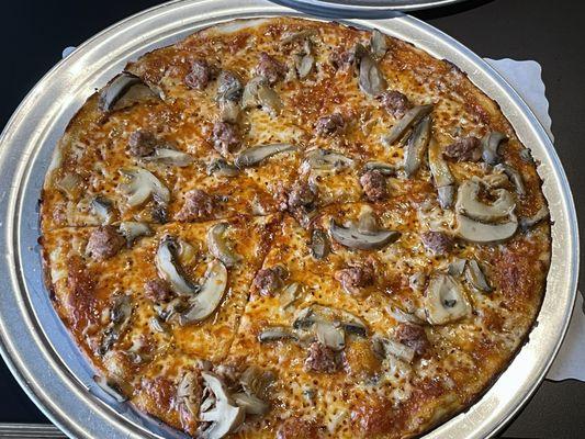 Cheese pizza add mushrooms and sausage. $15.49