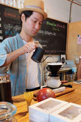 Barista Yuji prepares a Japanese style pour over at Fishcake.