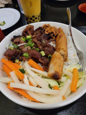 Vermicelli noodles with grilled pork and egg roll