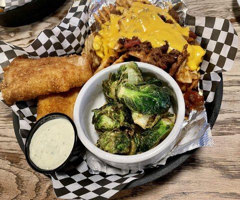 Fish dinner with Fried Brussels Sprouts and waffle fries with chili and cheese