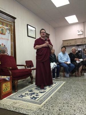 Lama Sean welcoming visitors in the sitting room