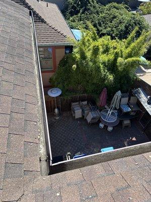 After: Gutters Cleaning  all gutters are cleaned and debris-free, with the roof cleaned and looking fresh.