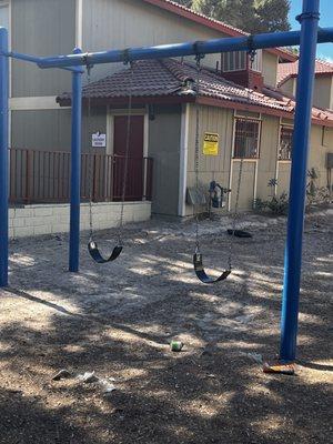 Kids playground full of glass and trash