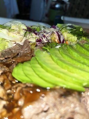 Fresh avocado on Pork and Beef Plate.