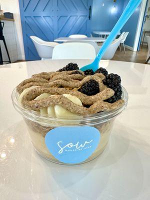 Sow smoothie bowl made with our peach base, house made granola, bananas, blackberries and almond butter