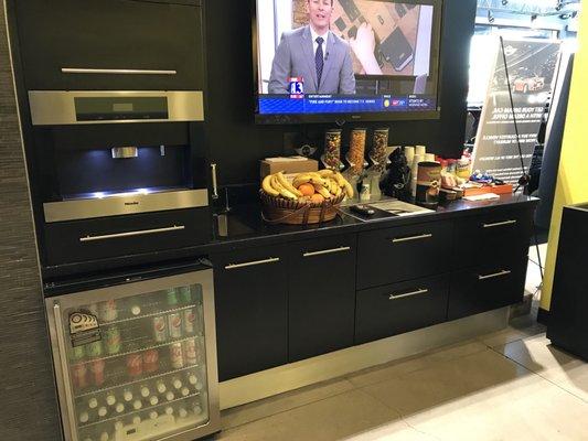 Service waiting area has drinks, coffee and snacks.