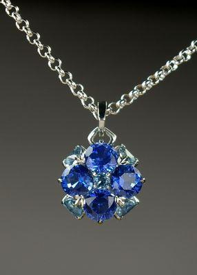 Sapphire and aquamarine set platinum pendant by Crane Jewelers in Seattle Washington. Copyright 2018