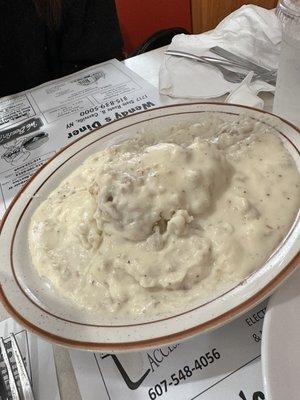 Half order of sausage n gravy over biscuits