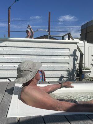 My husband in the foreground and Friend in the upper tub