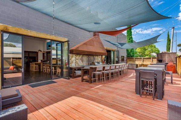 Patio with rotisserie grill and wood burning pizza oven