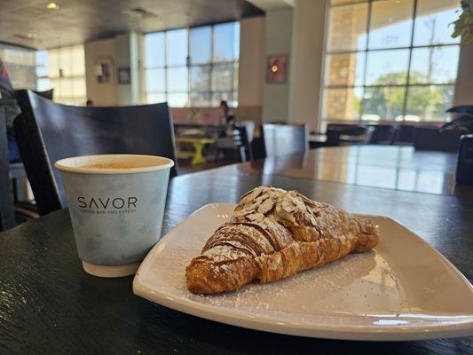 Ambience with cappuccino and almond croissant