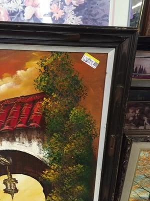 All the really nice oil paintings are ruined by their military strength price stickers placed directly on the art! Seriously? !