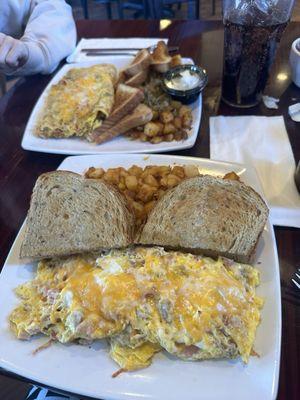 Mexican omelette with white toast and a meat lovers omelette with rye