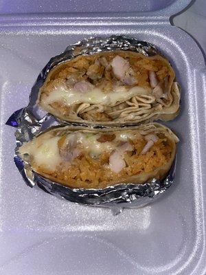 chicken burrito with rice, lettuce, and extra cheese