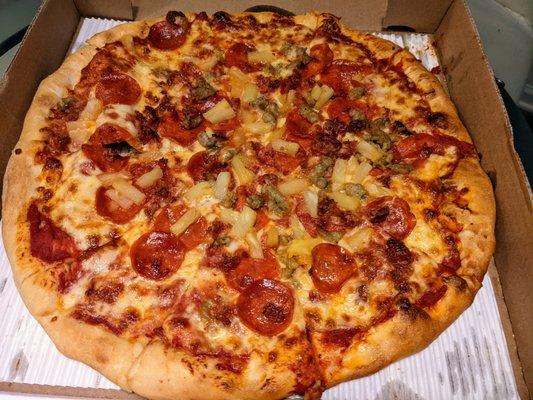 I cannot get over the lovely, chewy crust. As always, I loaded it with pineapple chunks (more pineapples please), pepperoni, and sausage.