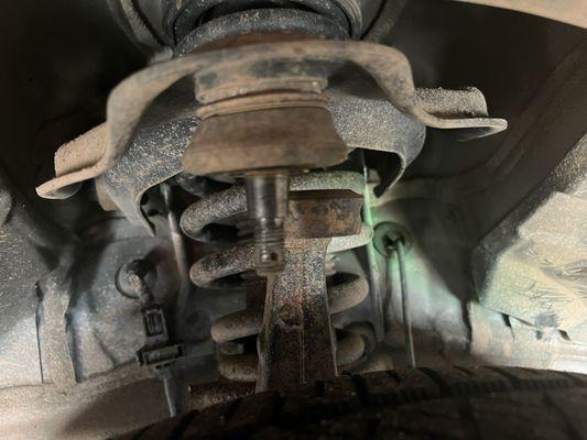 Upper control arm with no knuckle attached. Not castle nut or cotter pin. They never checked it and this risked my life.