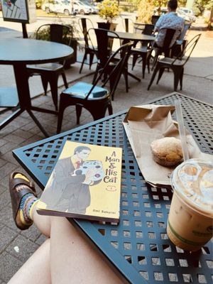 Chai latte and a donut muffin on their outdoor patio